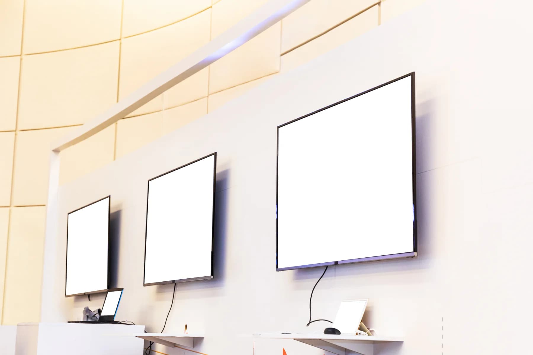 4K televisions showing vibrant branded content at an event or premium presentation environment