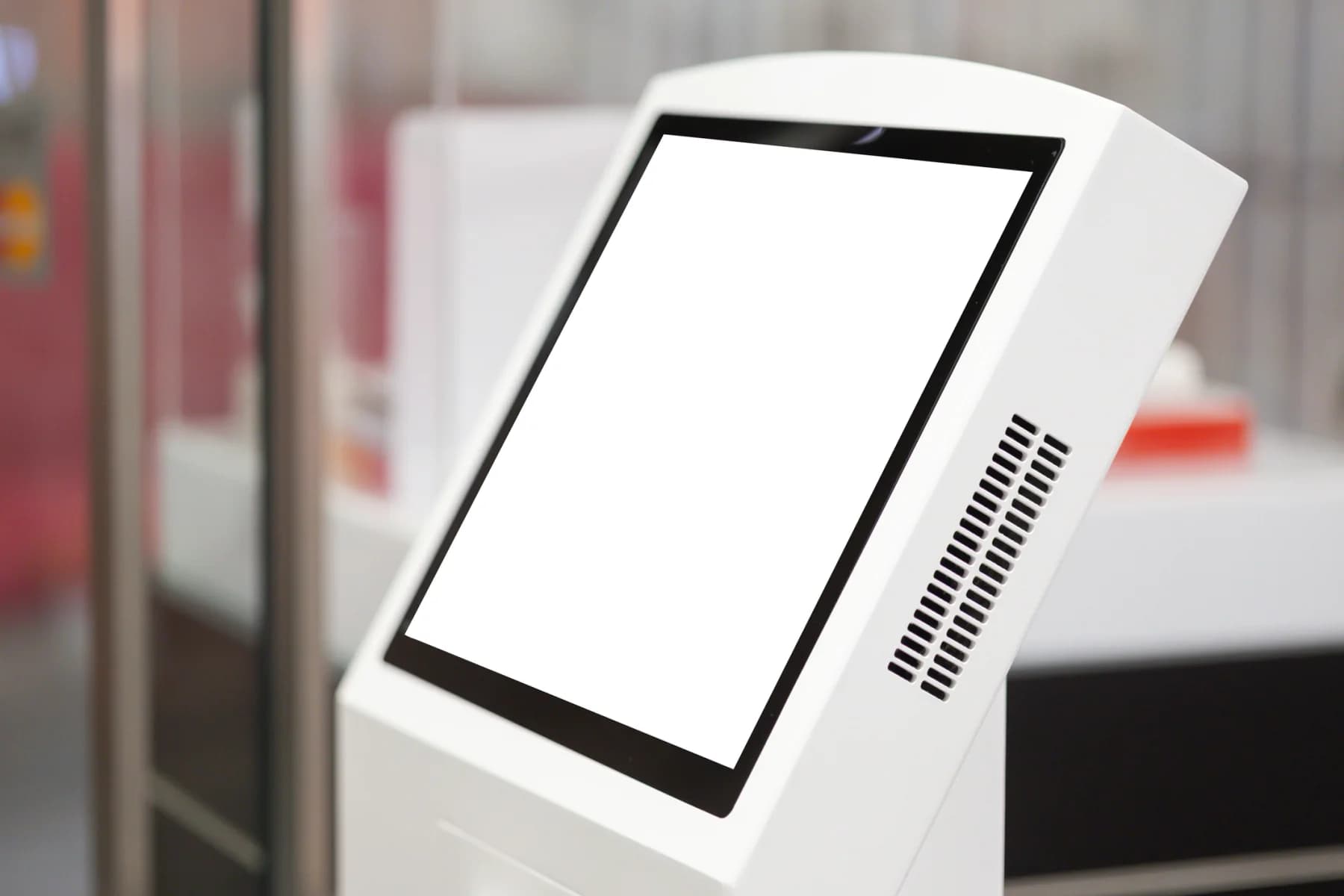 Person using a touchscreen kiosk at an event for registration navigation or interactive content