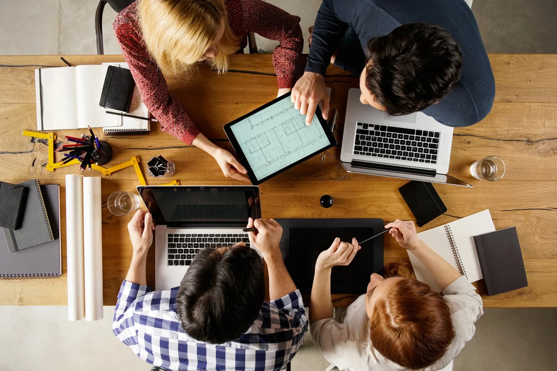 Several iPads arranged on a table in a meeting and event environment for registration, demos, and mobile business use