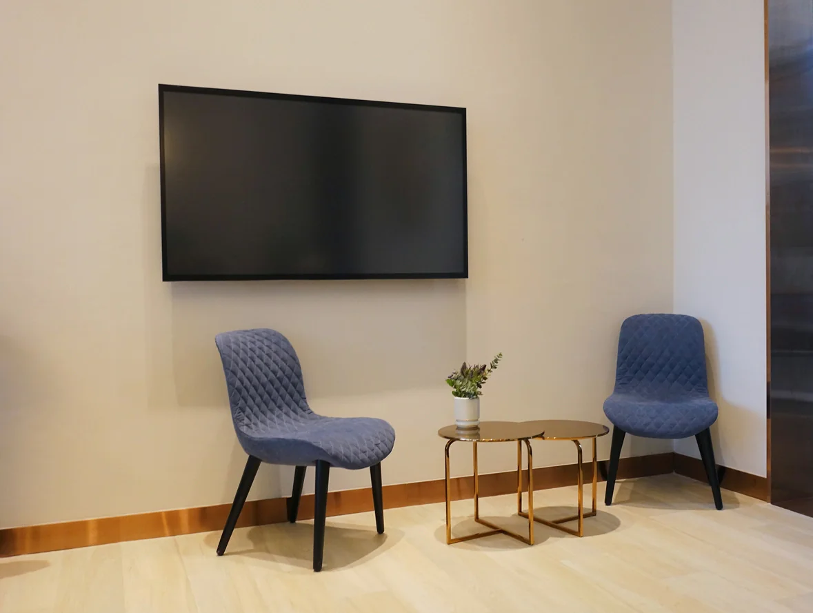 Large format 4K display showing premium branded visuals in a lobby or event environment