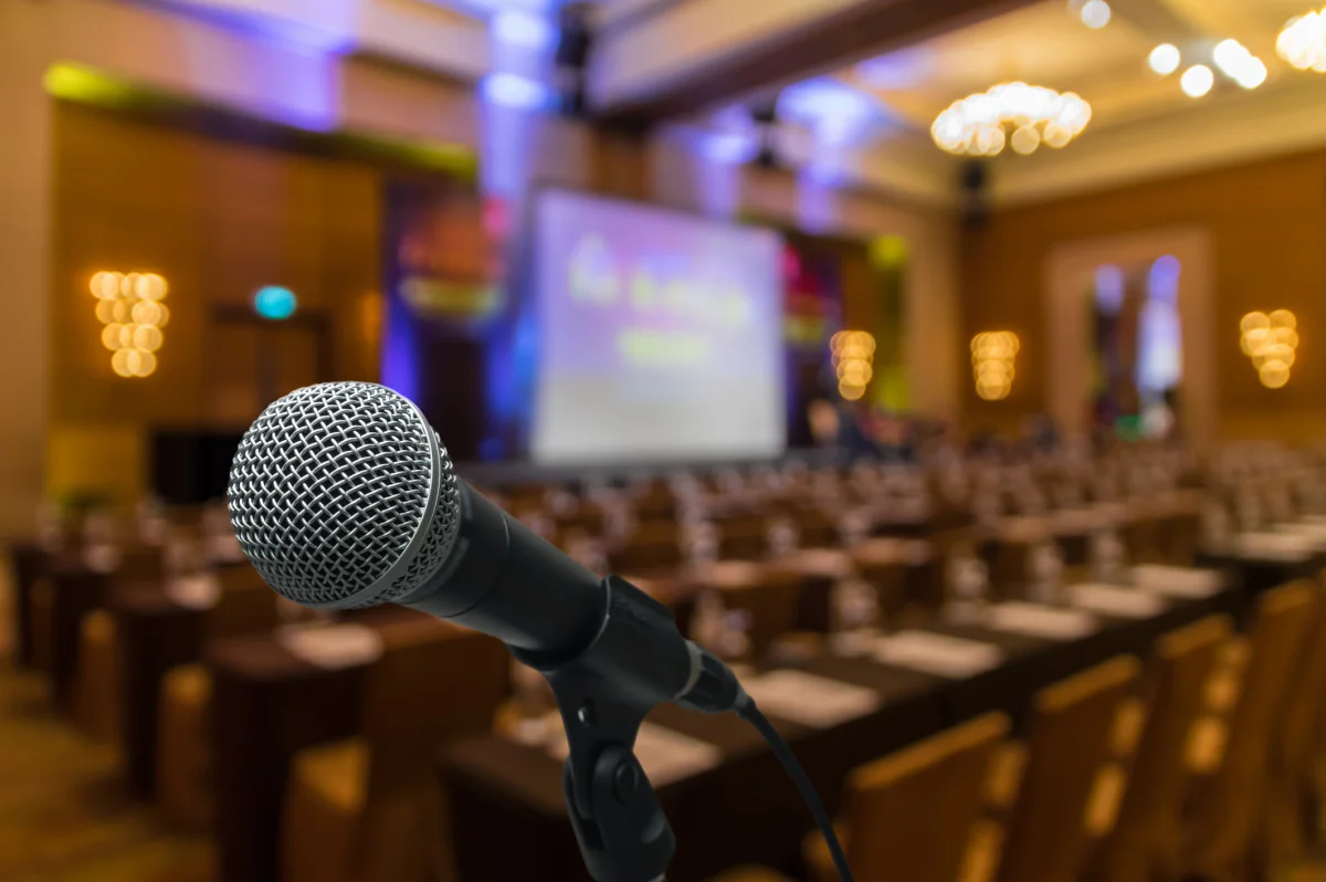 Presenter microphone setup for keynote speaking training delivery and business event audio support