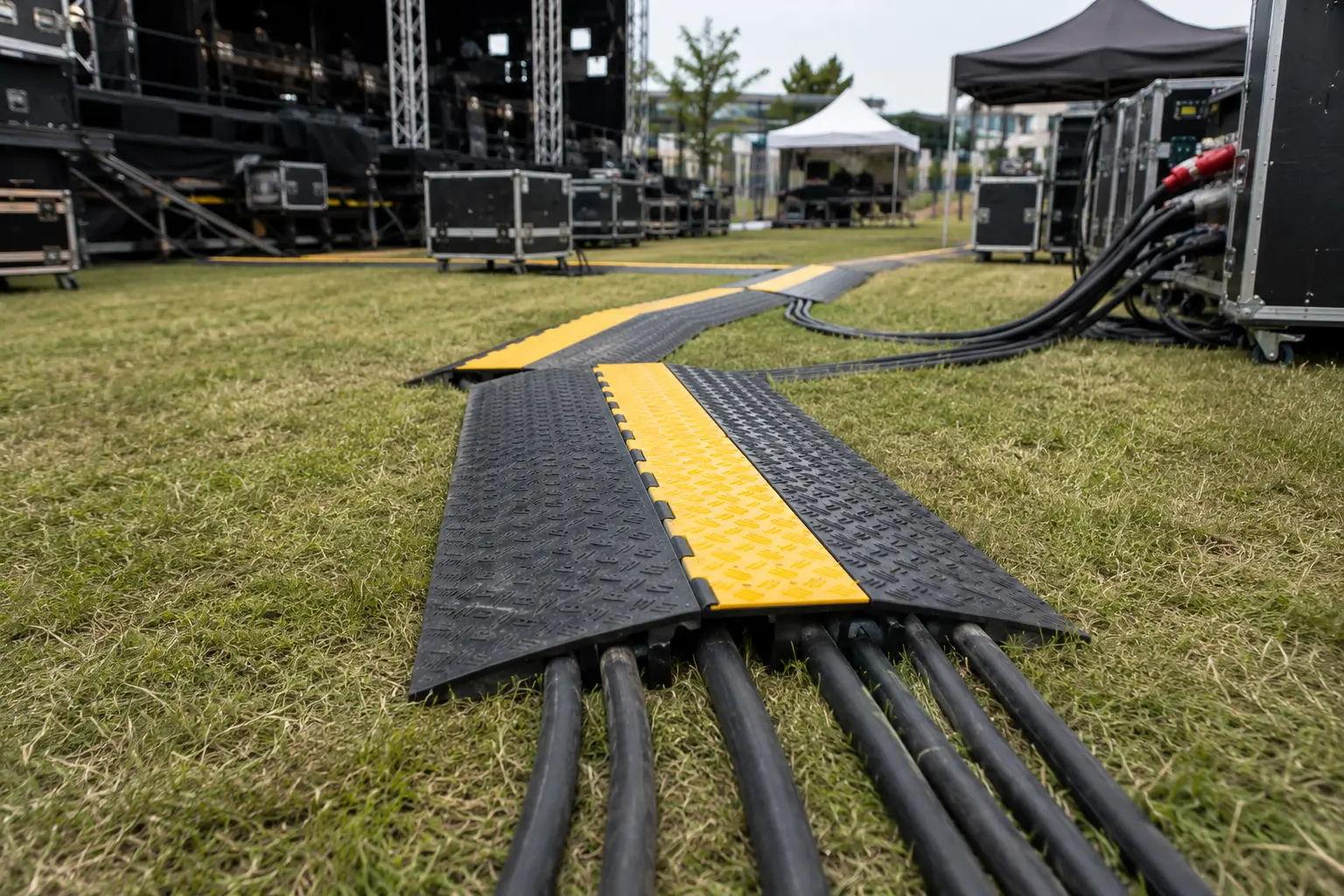 Event power cabling and cable ramps routed safely across a temporary production environment