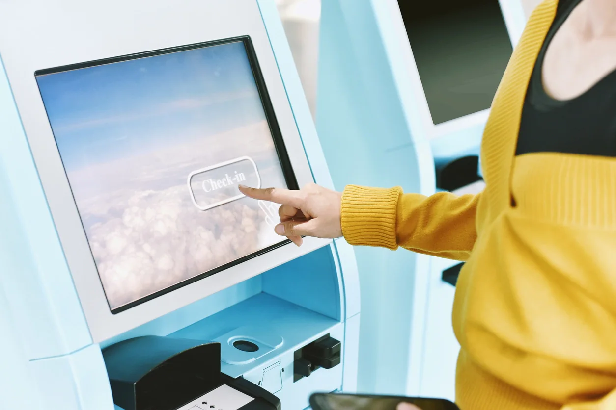 Touchscreen kiosk being used by an attendee for product exploration registration or interactive event content