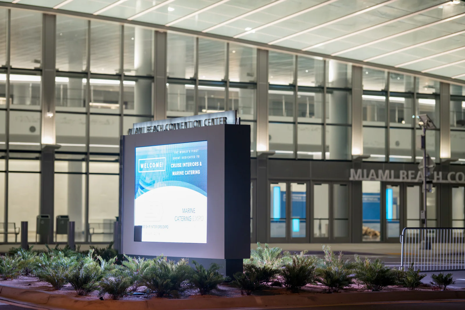 Digital directory sign in a campus style environment guiding visitors across multiple buildings and event zones