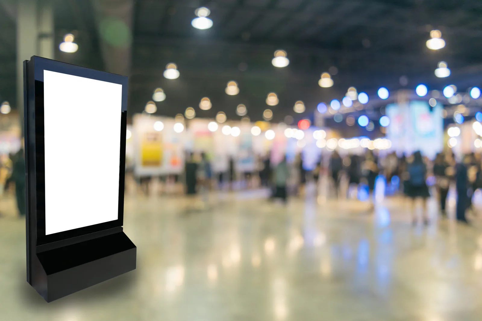 Digital signs outside conference rooms showing schedules session titles and directional information
