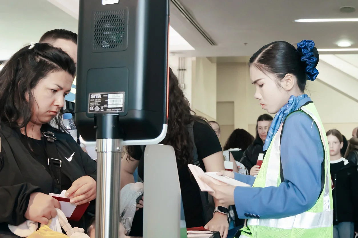 Person using touchscreen kiosk for event registration lead capture or attendee check in