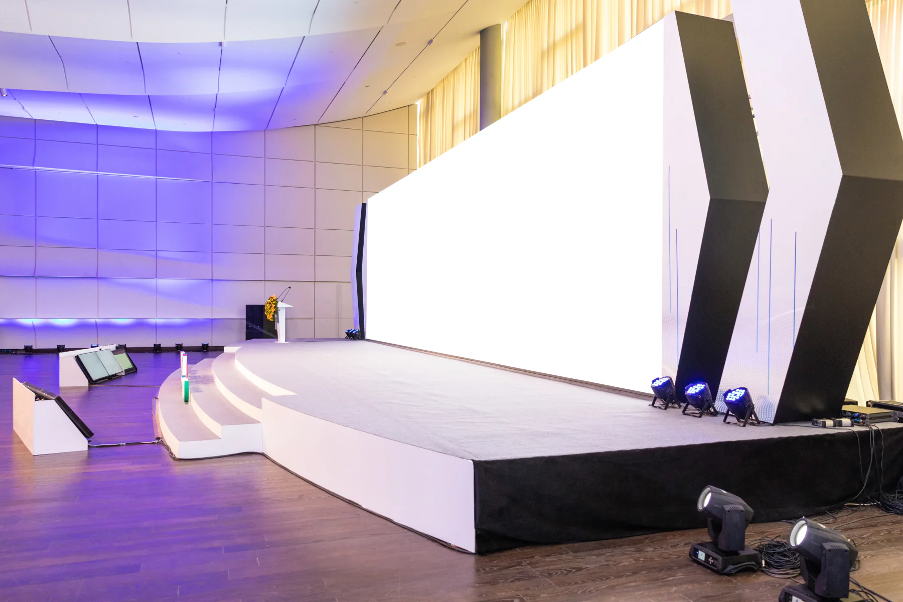 Stage risers and platform sections used for demo zones sightline improvement and presentation visibility