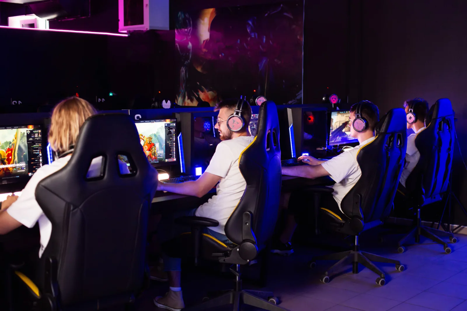 Esports tournament with rows of matching performance stations and gaming desktop setups