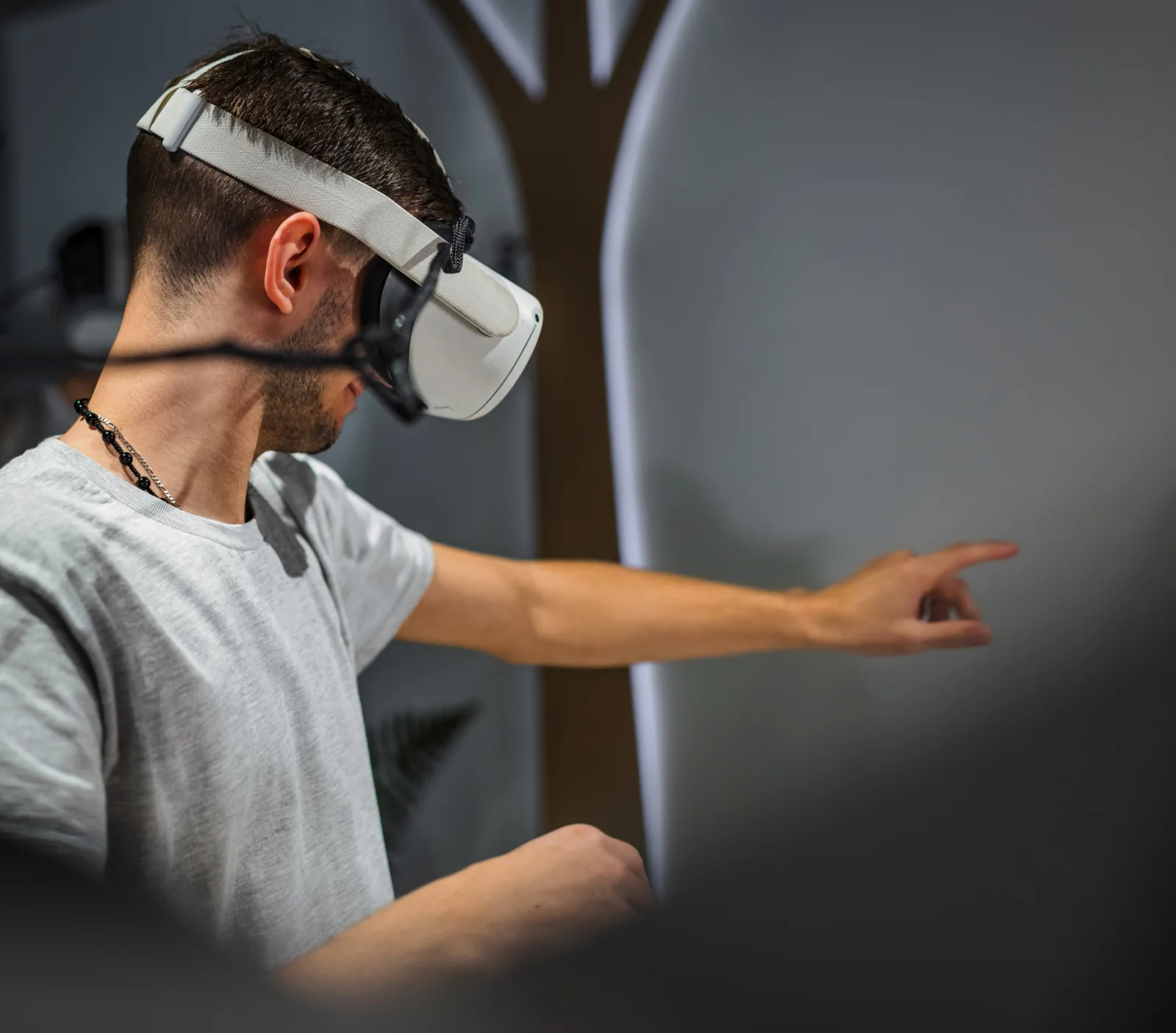 Person using a VR headset at an event with high performance computer hardware supporting the experience
