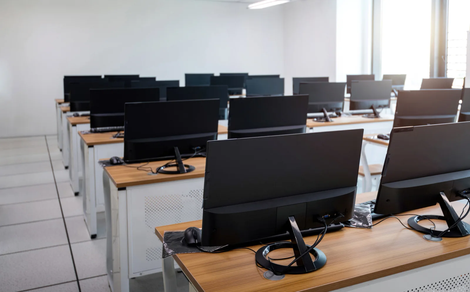 Standardized Dell Windows rental fleet with matching business laptops and accessories prepared for a corporate rollout or training deployment