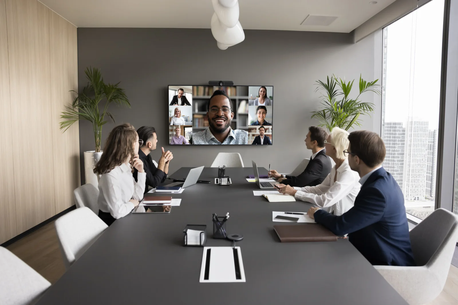 Microsoft-friendly meeting room AV setup with large display, video conferencing gear, and business presentation support