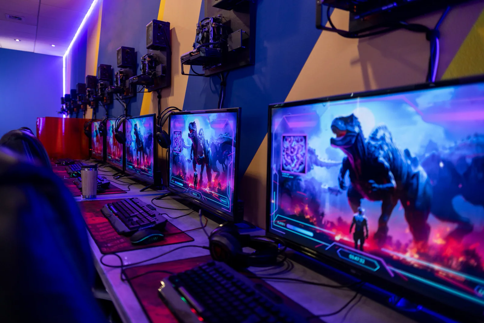 Cables adapters and monitor accessories arranged next to a gaming monitor for event deployment planning