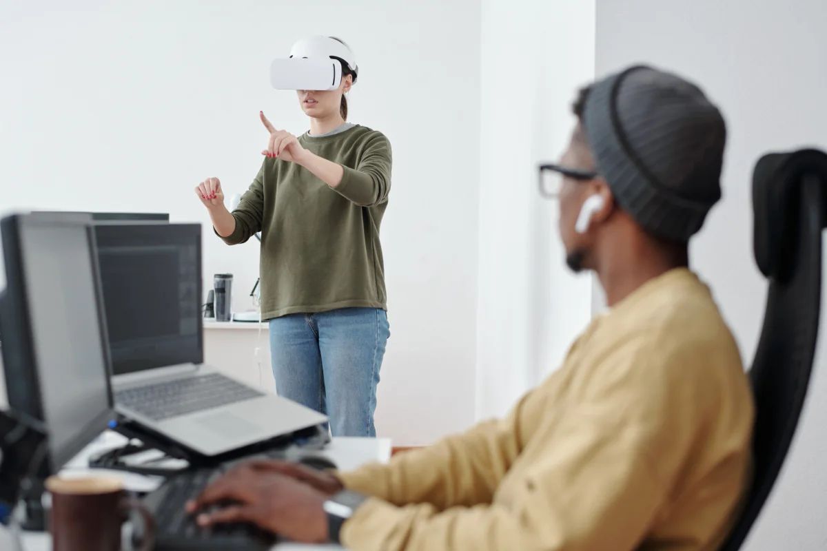 Structured VR training setup with guided headset station and mirrored monitor for instruction