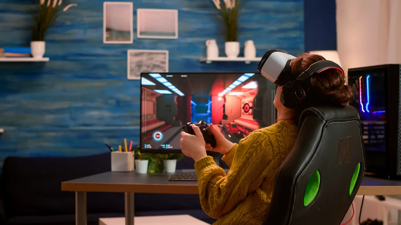 VR showcase station with headset performance desktop and mirrored monitor for stakeholder review