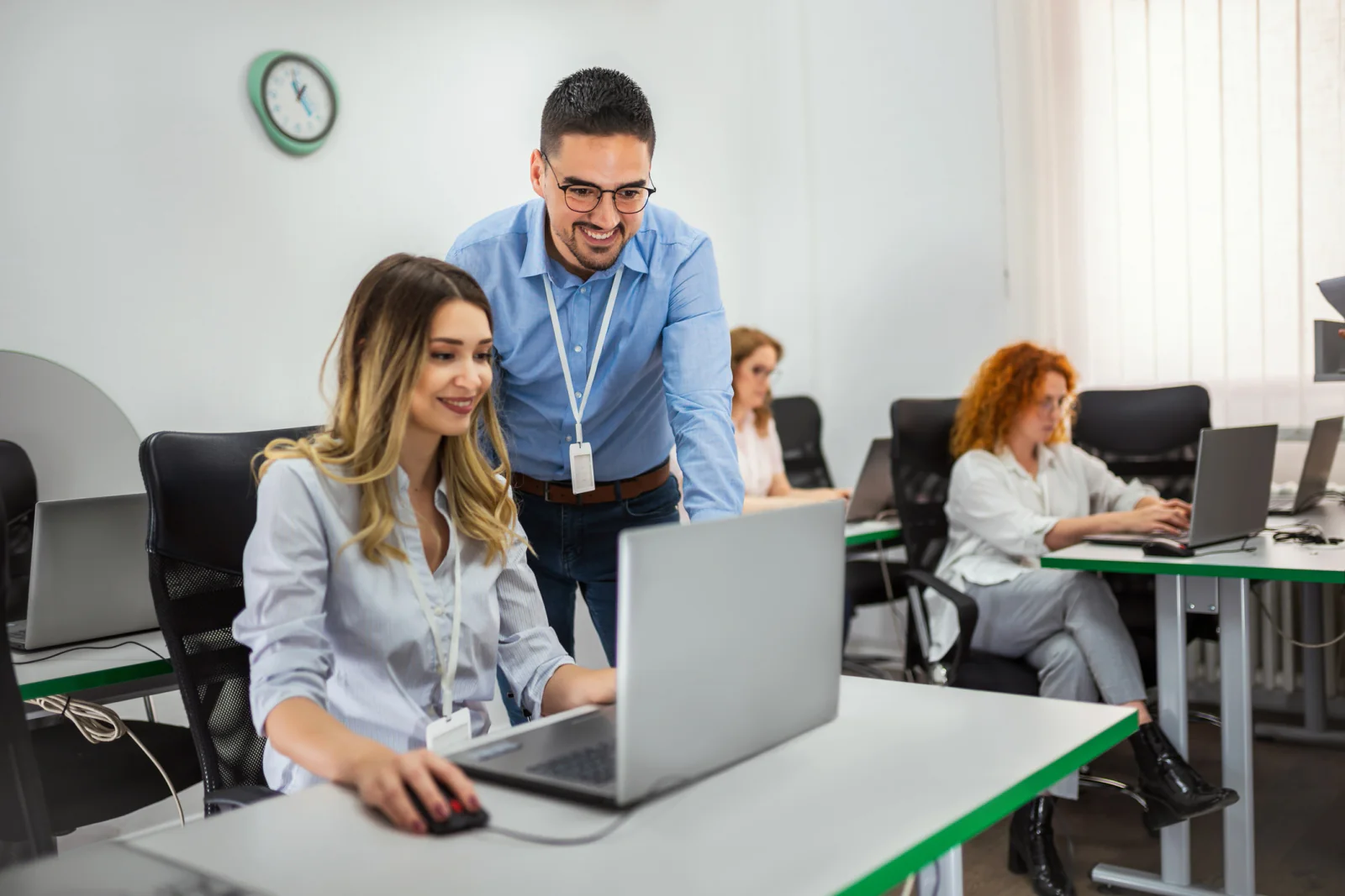 Employee onboarding classroom with rental laptops arranged for new hire training and internal systems instruction