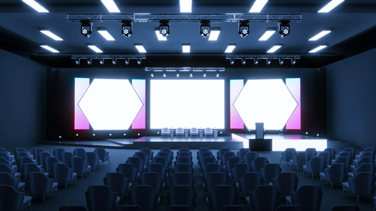 Standardized conference room technology package with rental display, laptop, microphones, and consistent room layout across event sessions
