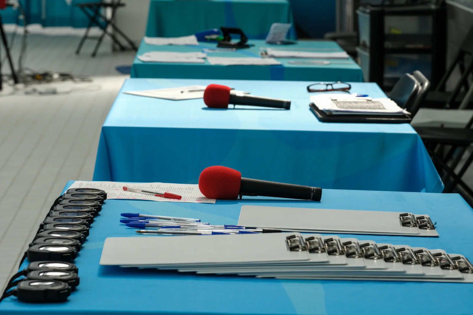 Conference attendee registration and badge printing area using rental tablets, laptops, scanners, and printers for on-site support