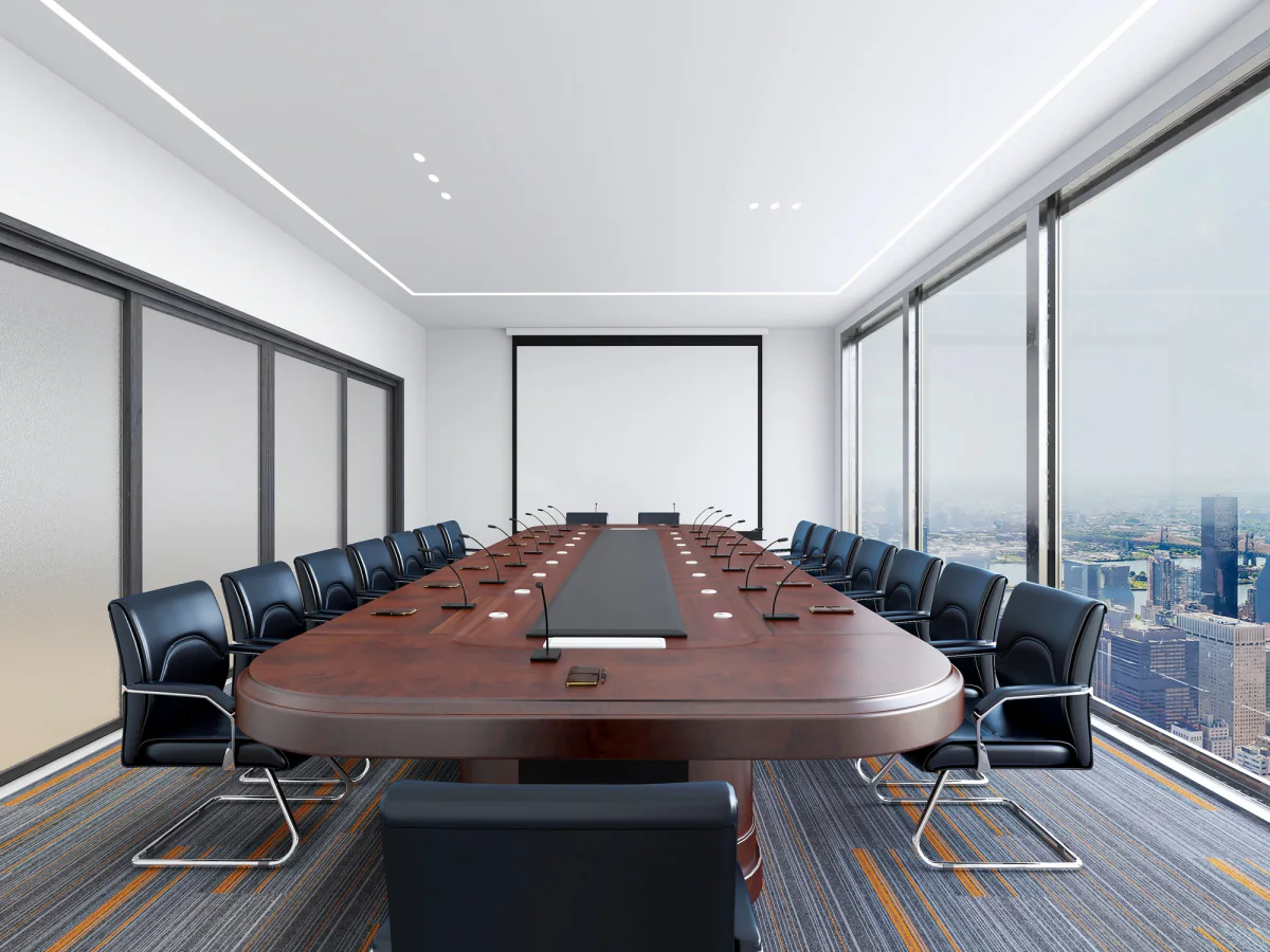 Hybrid corporate meeting setup with rental hotspot connectivity, laptop, and display supporting remote presentation workflows