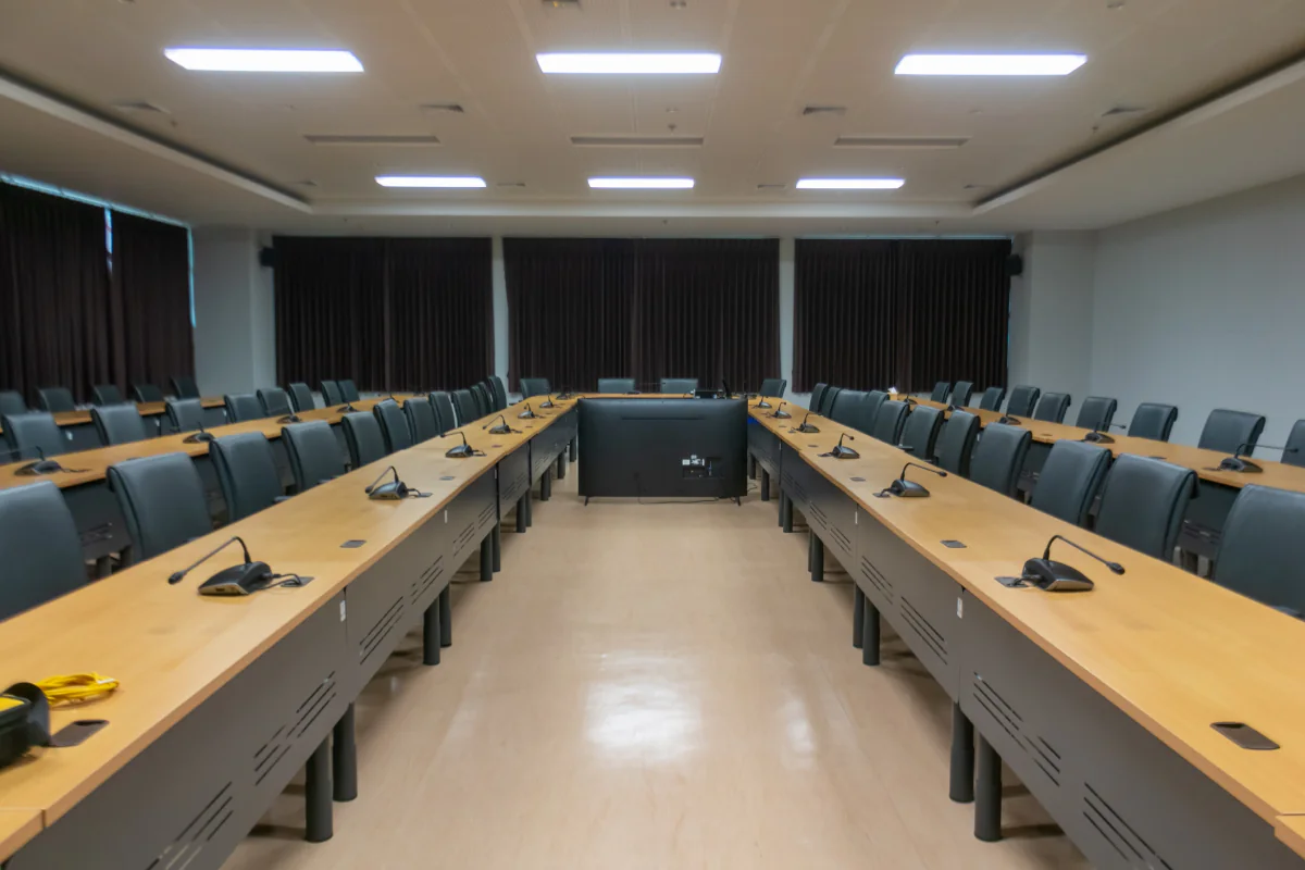 Professional corporate meeting room with rental display, laptop, and polished presentation setup for executive or client discussions