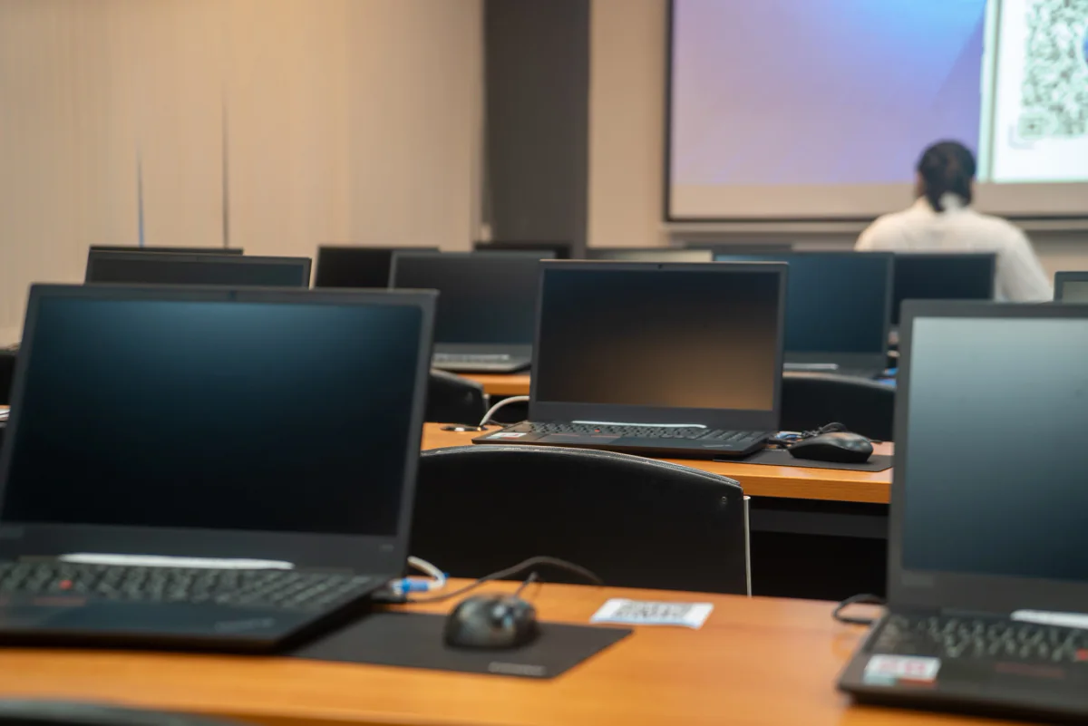 Standardized fleet of rental laptops and peripherals organized for a testing program with matching hardware and software configurations