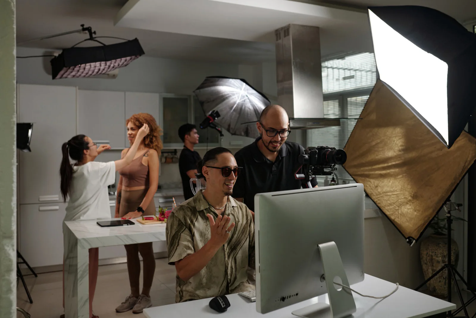 Temporary branded content studio with editing workstations reference monitors cameras and creator collaboration workspace