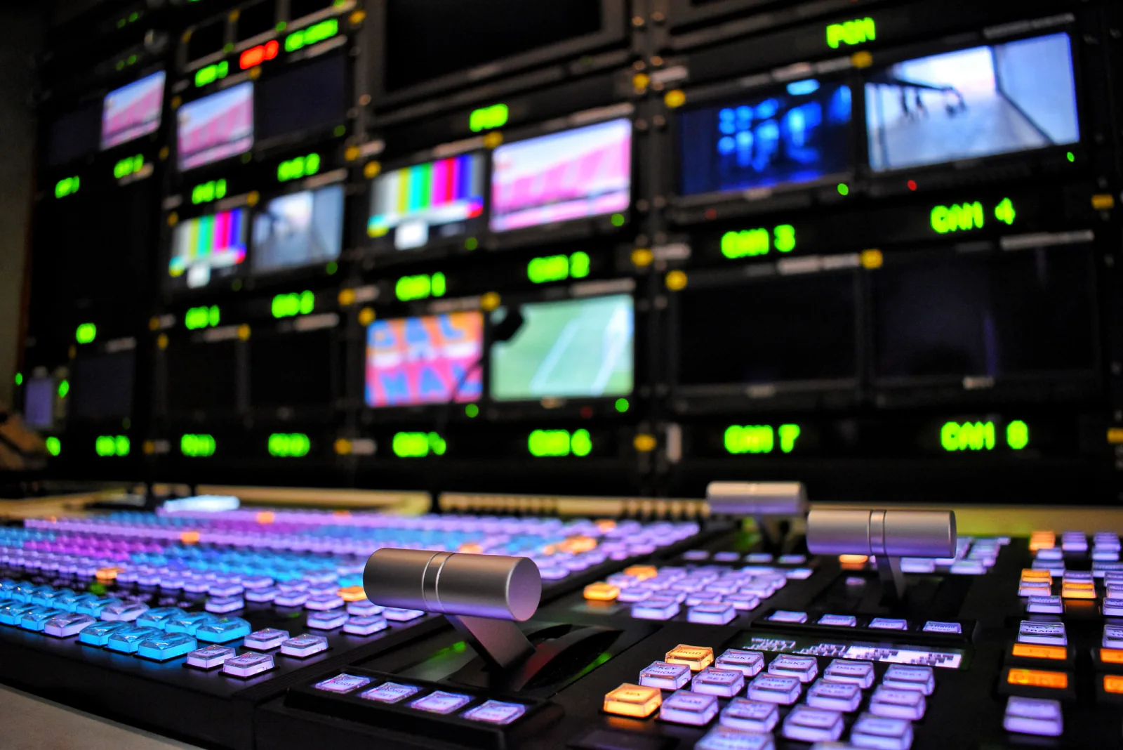 Broadcast control room managing multiple sports feeds on large displays