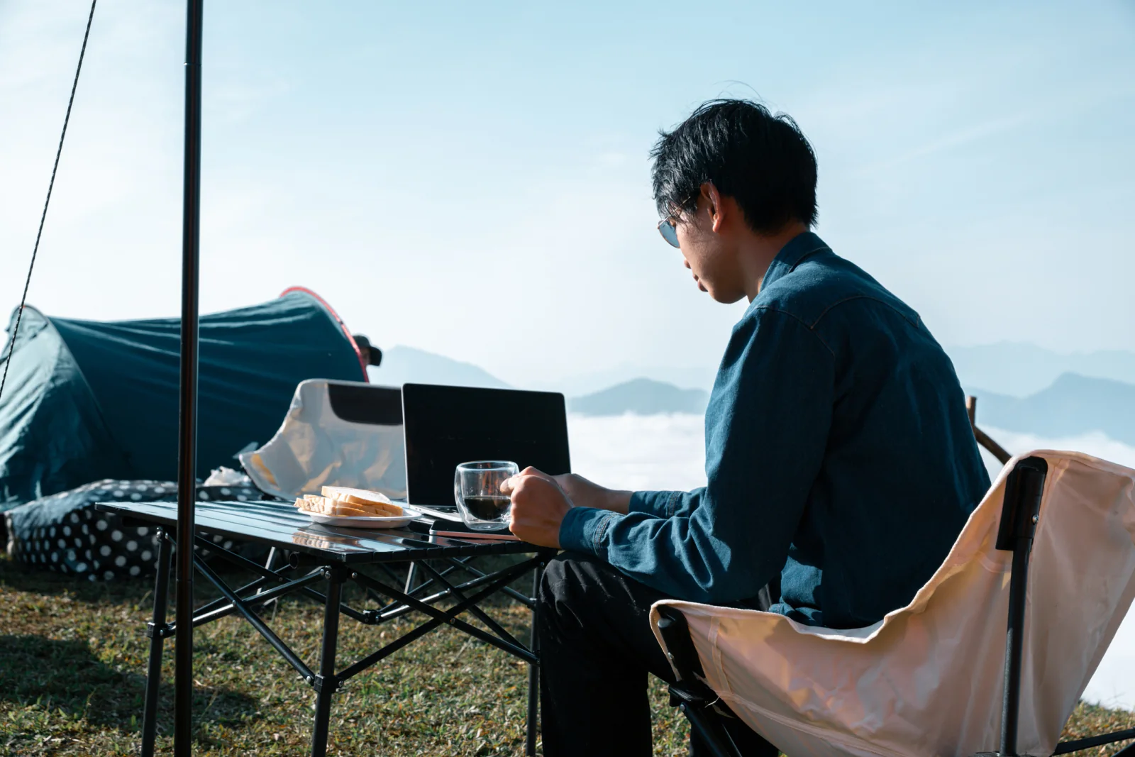 Home and remote work setup with business laptop, external monitor, headset, and mobile connectivity for continuity operations