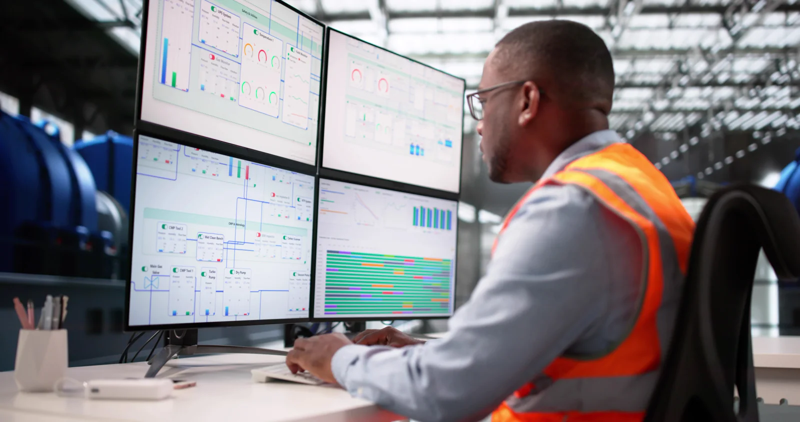 Turnaround command center with multiple operators, wall displays, workstations, and planners coordinating refinery outage activity