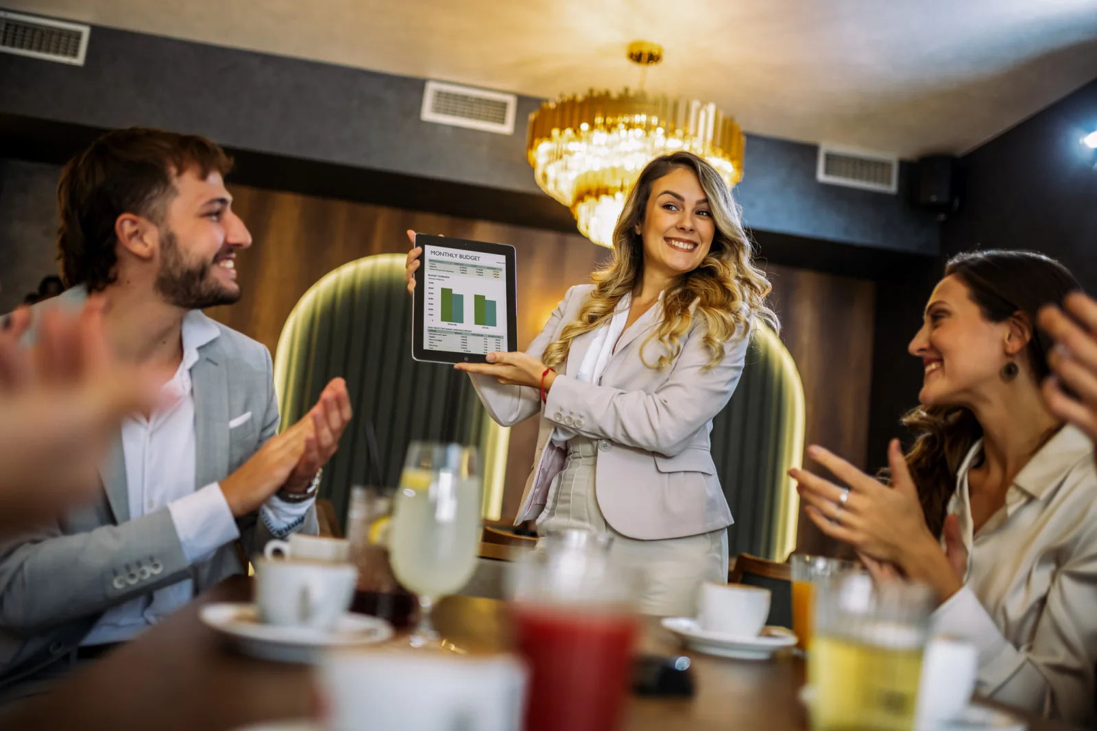Restaurant private event with digital menu displays, guest check-in tablet, and sound system in an upscale dining space