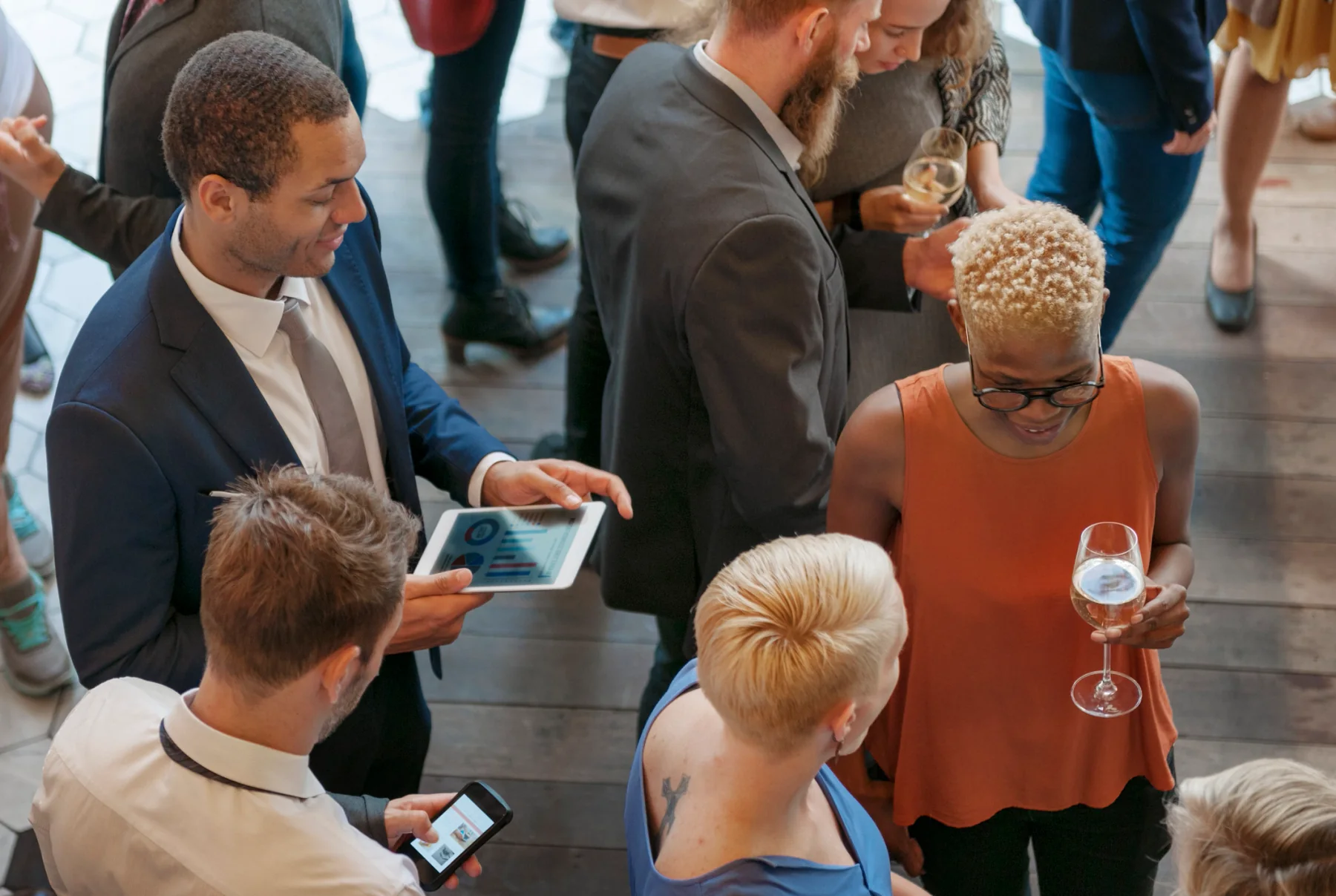 Nonprofit staff using laptops and tablets at an event registration area