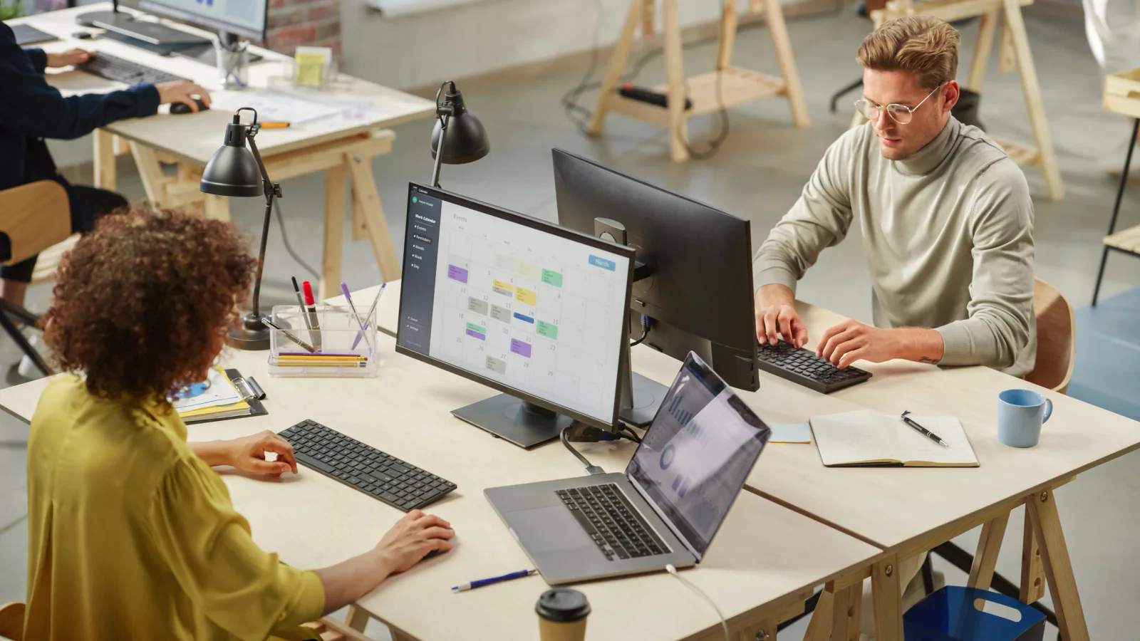 Retail or service business with additional seasonal staff using laptops and tablets