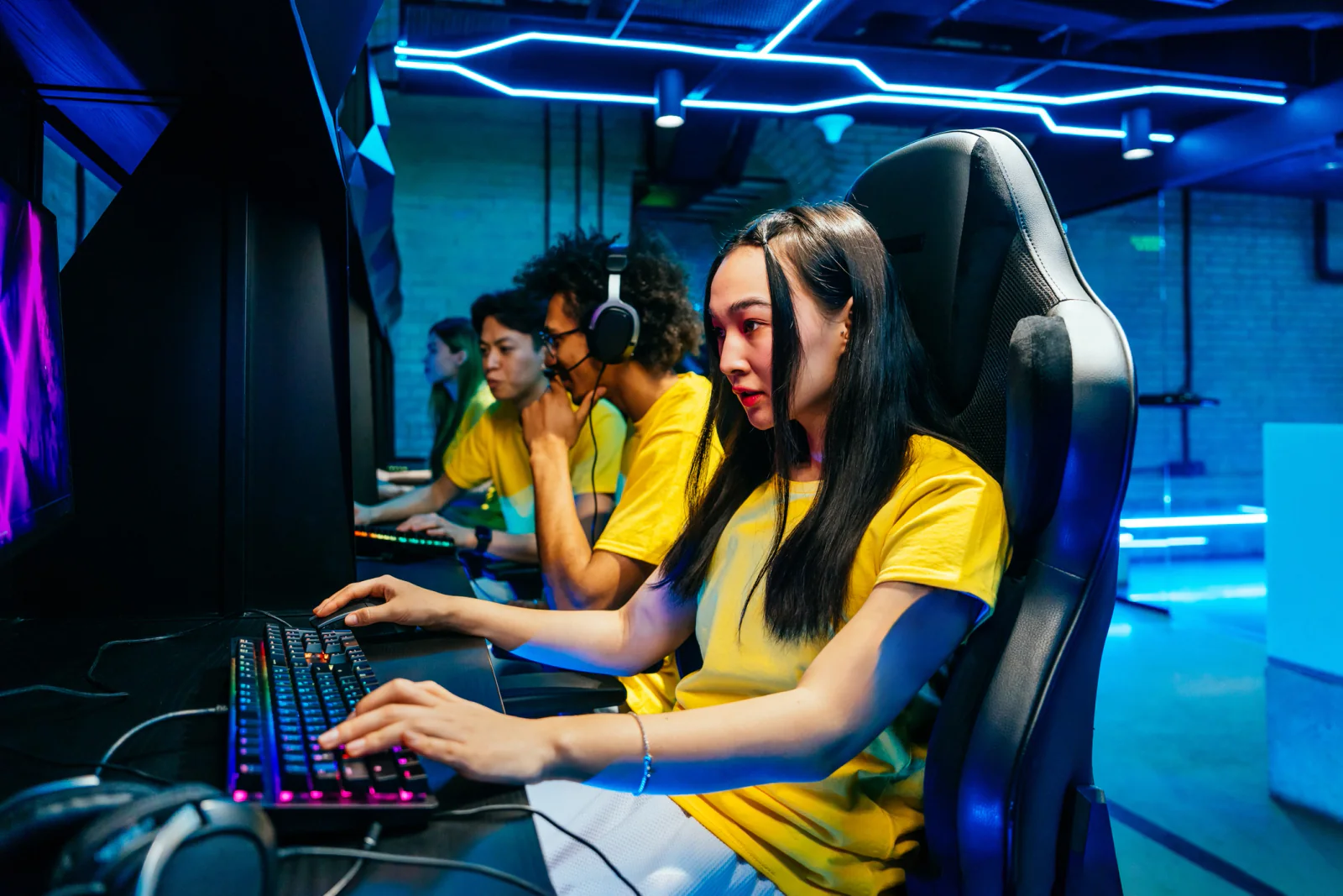 Gaming activation area at an expo with multiple demo stations and branding