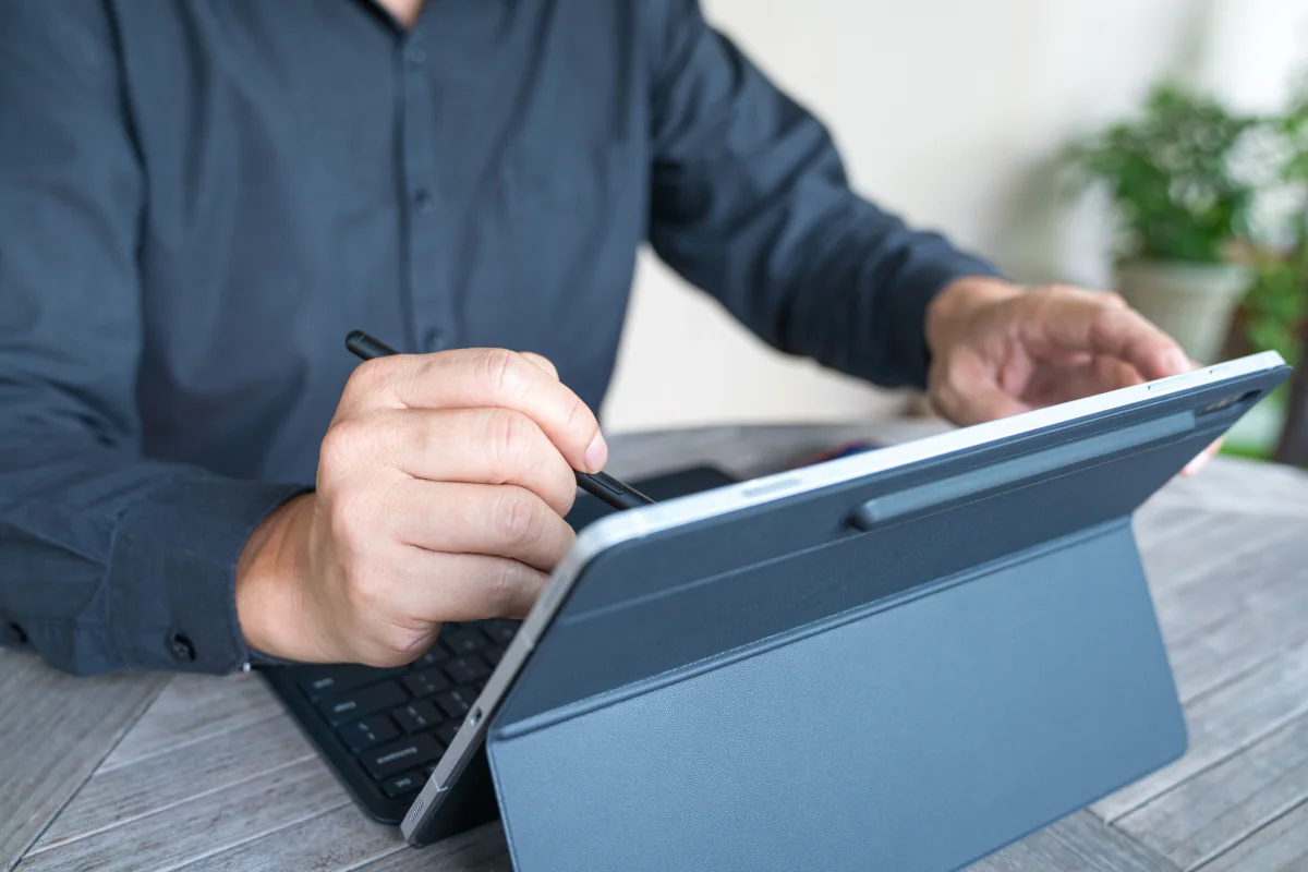 Touch and pen enabled Microsoft Surface devices displayed for interactive demos and digital note taking