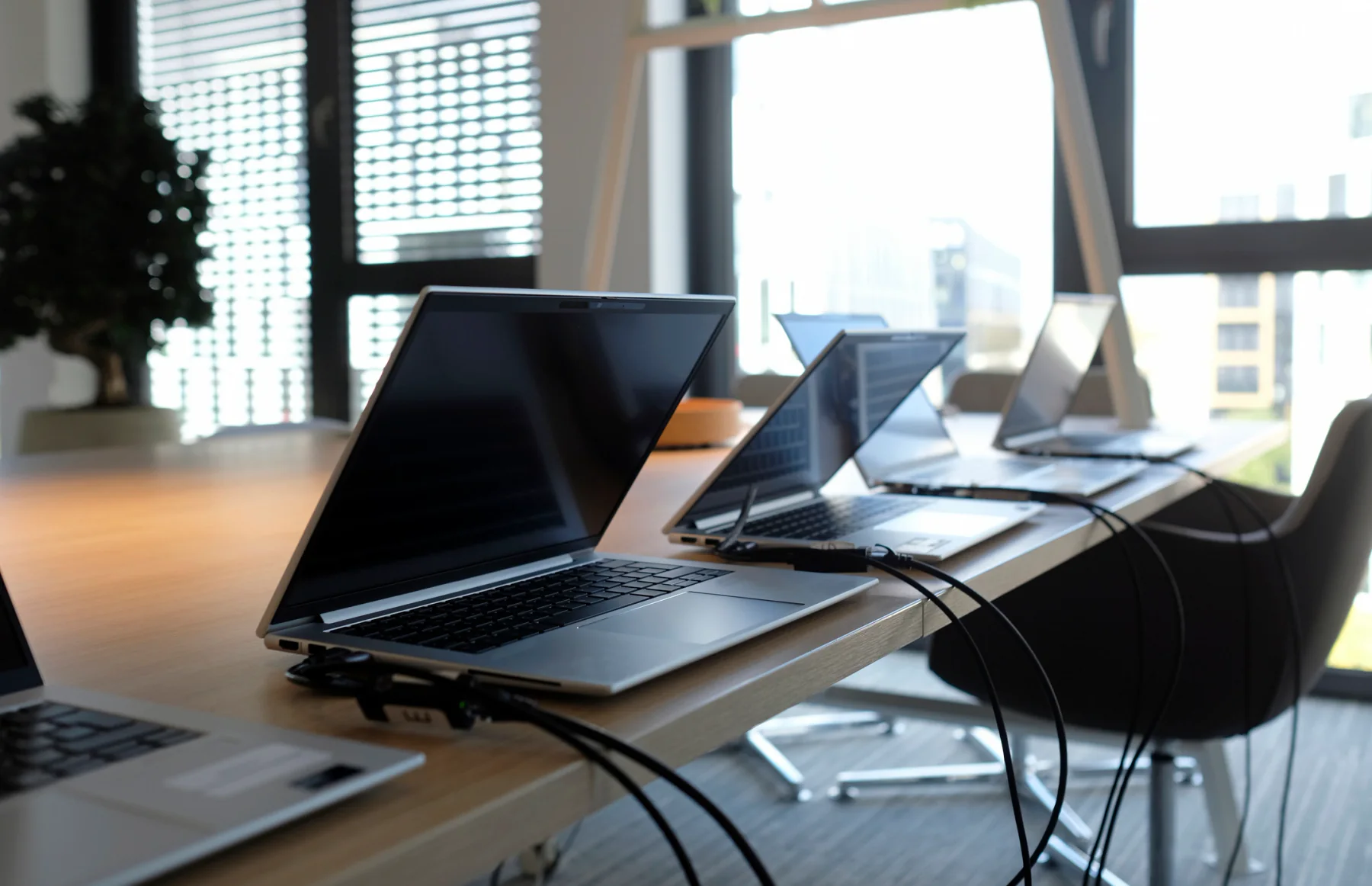 Spare standardized laptops with matching software setup prepared for quick device replacement during a live training or deployment