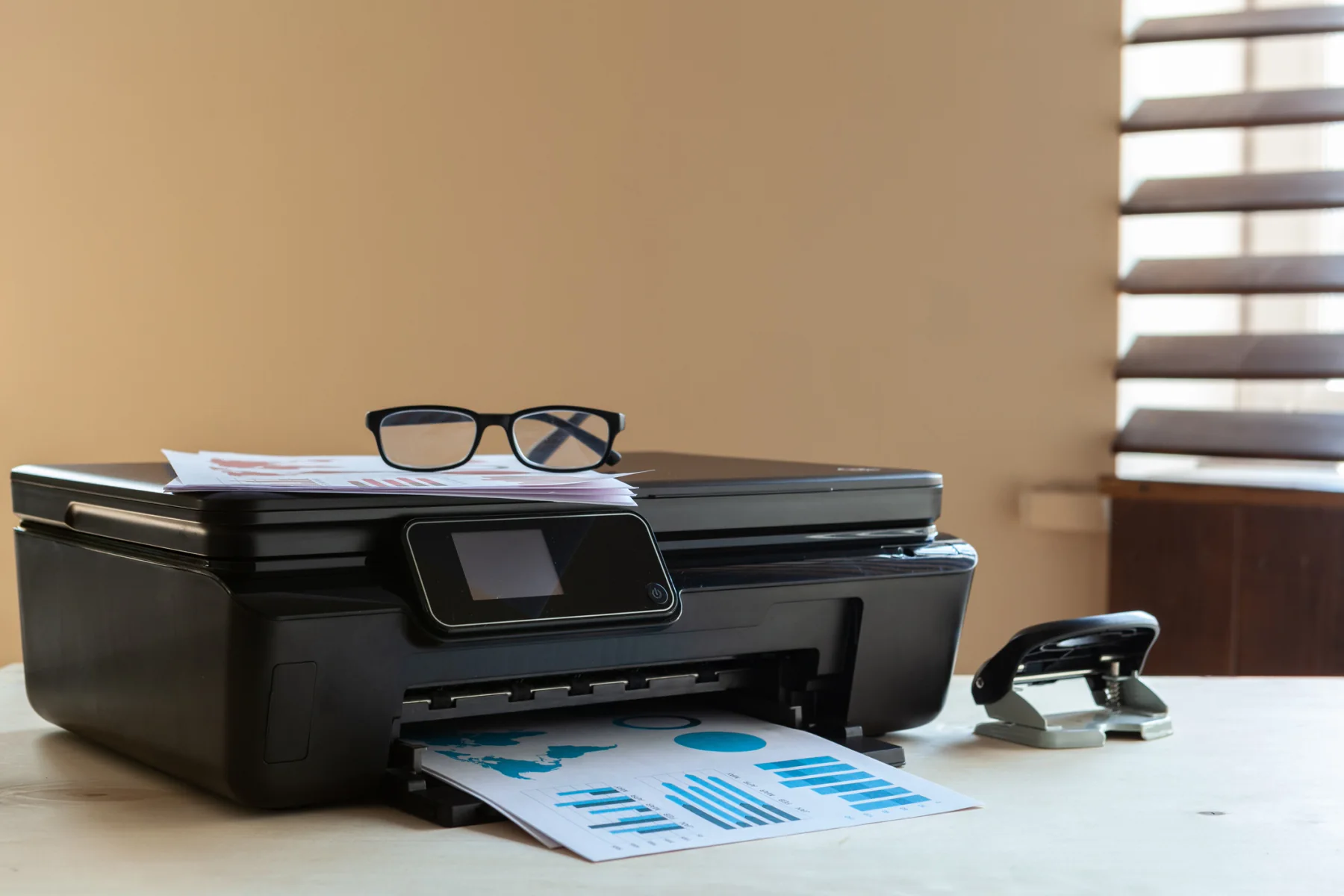 Modern office printer in a bright temporary office environment supporting short-term business workflows