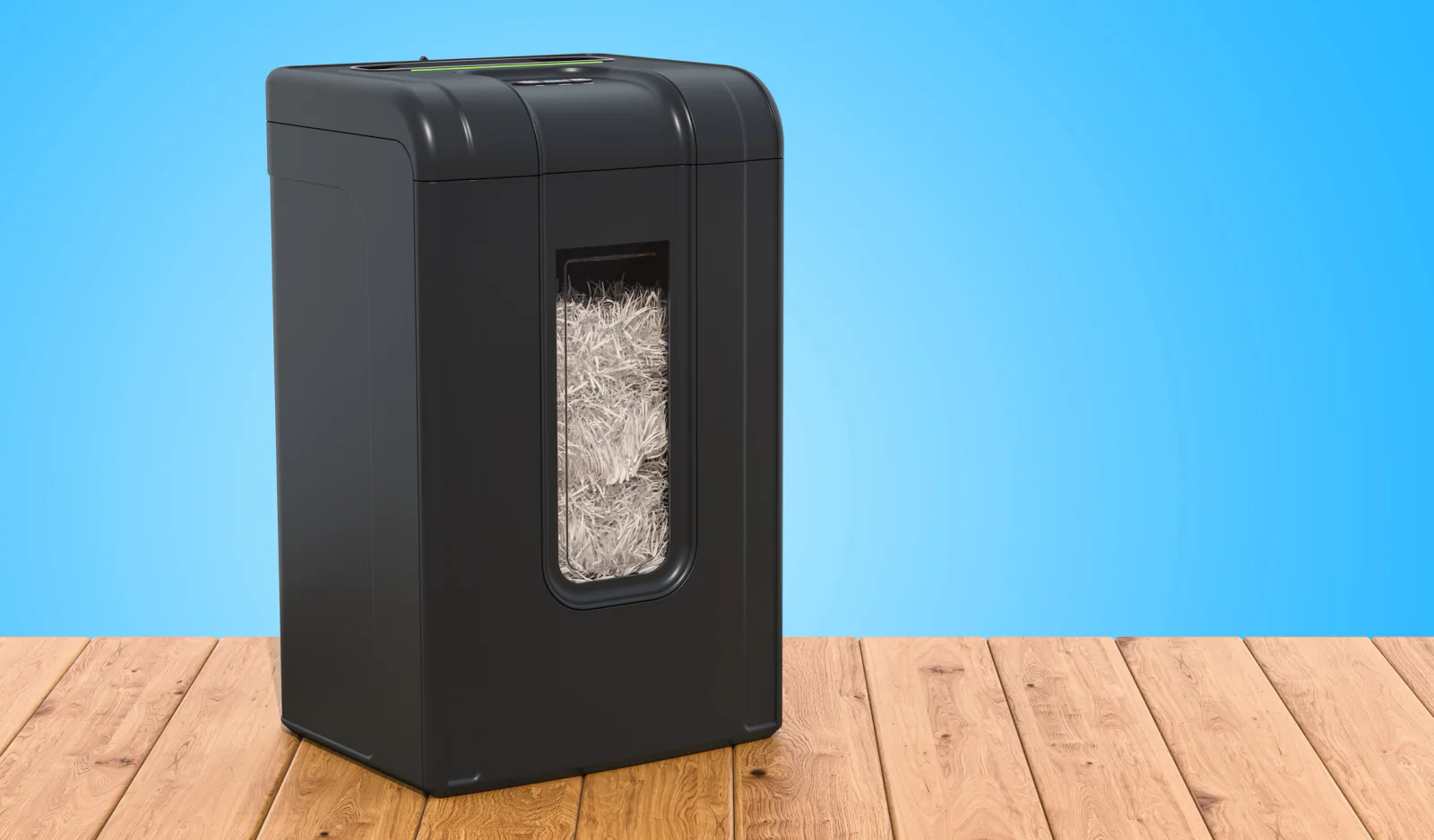 Departmental shredder located in an office copy room for shared document destruction workflows