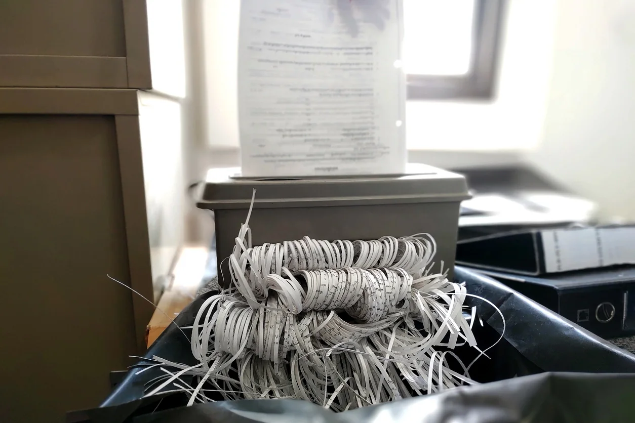 High-capacity paper shredder in a records storage area handling bulk document destruction