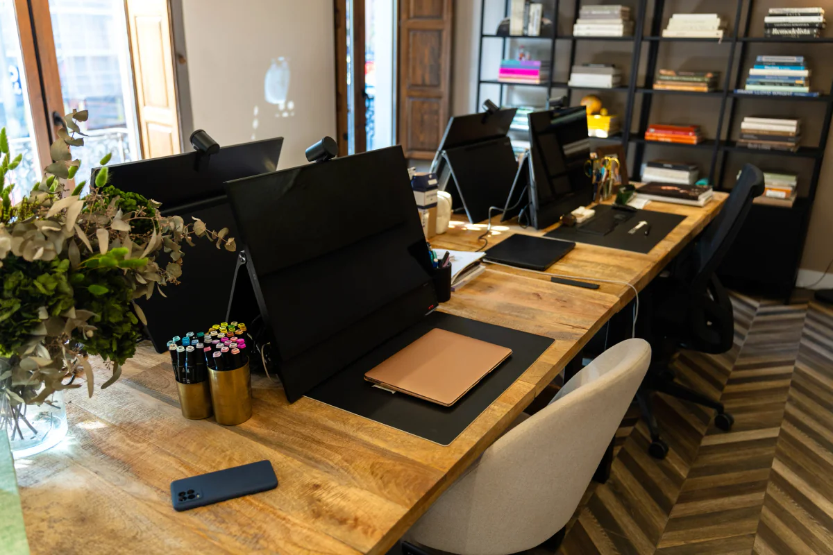 Registration and event operations desk with peripherals, webcam, and accessories for temporary setup
