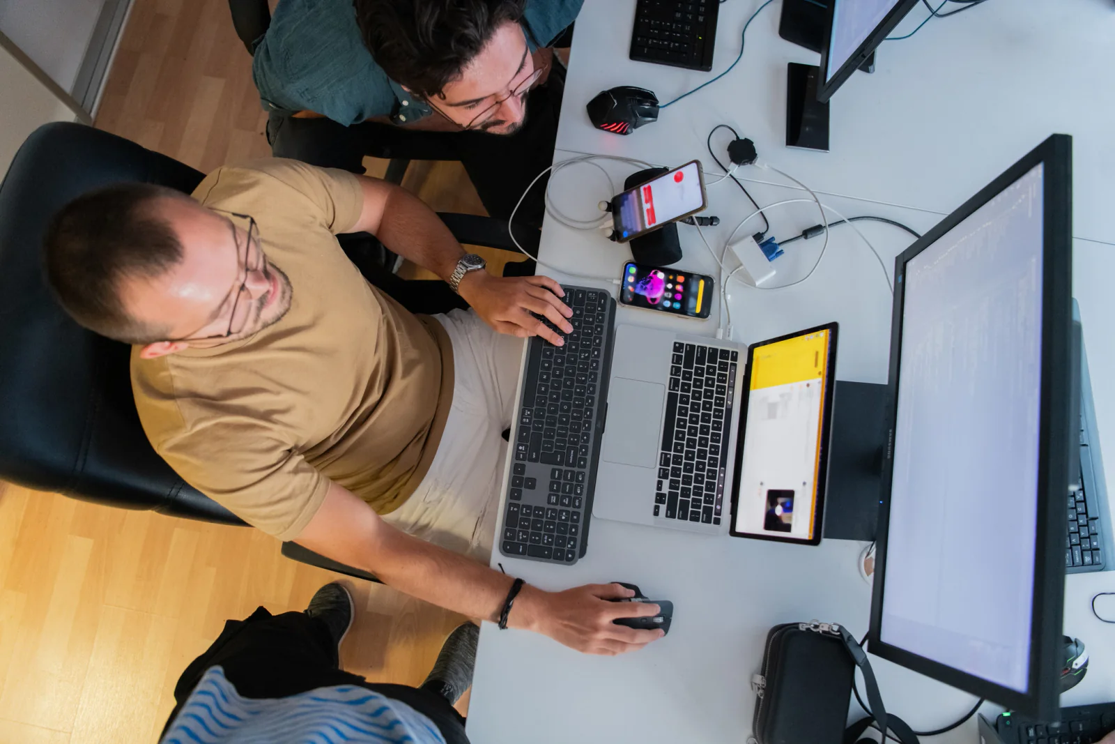 Developer onboarding or technical training session with attendees using matching rental laptops in a classroom environment