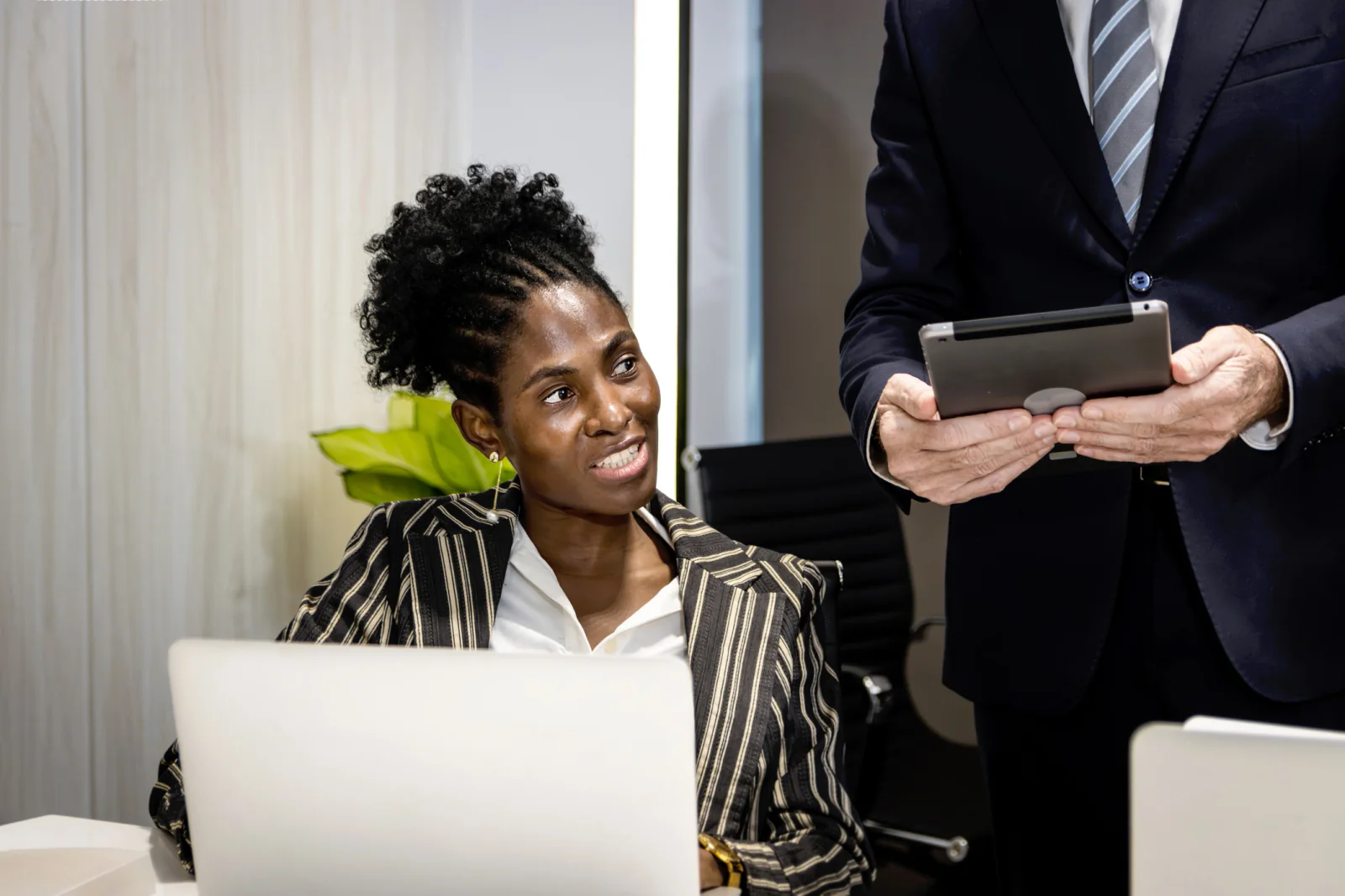 Sponsor activation booth with interactive screens, branded displays, and attendees participating in an event engagement experience
