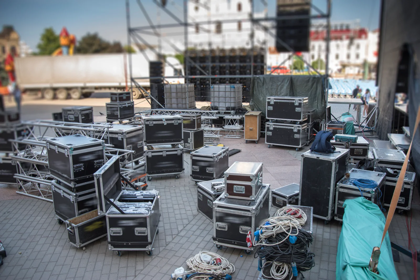 Concert credentialing and access control desk with staff using laptops, tablets, badges, and guest list technology