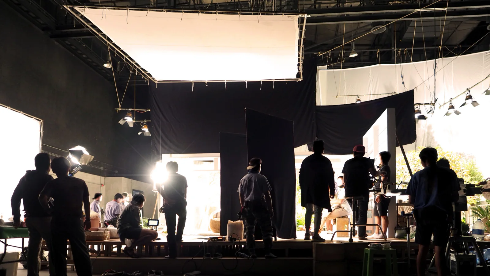 Turnkey event production setup with staging, seating, event technology, and staff coordinating a large live event environment