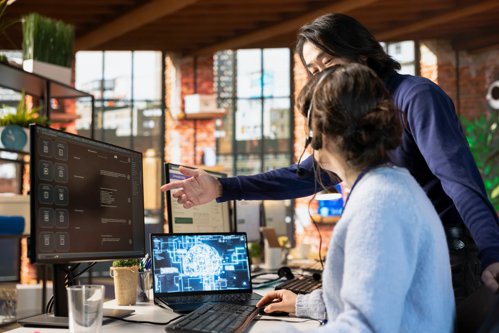 On-site IT support at a conference with technicians assisting registration desks, presentation rooms, and live event technology