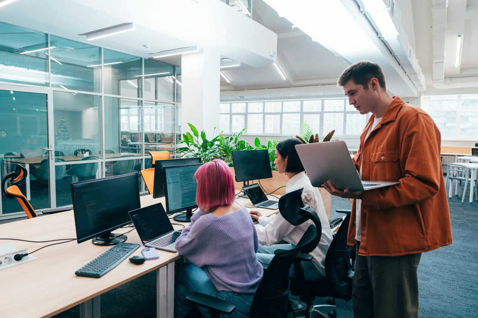 IT deployment team coordinating standardized laptop and monitor setups across multiple office or event locations