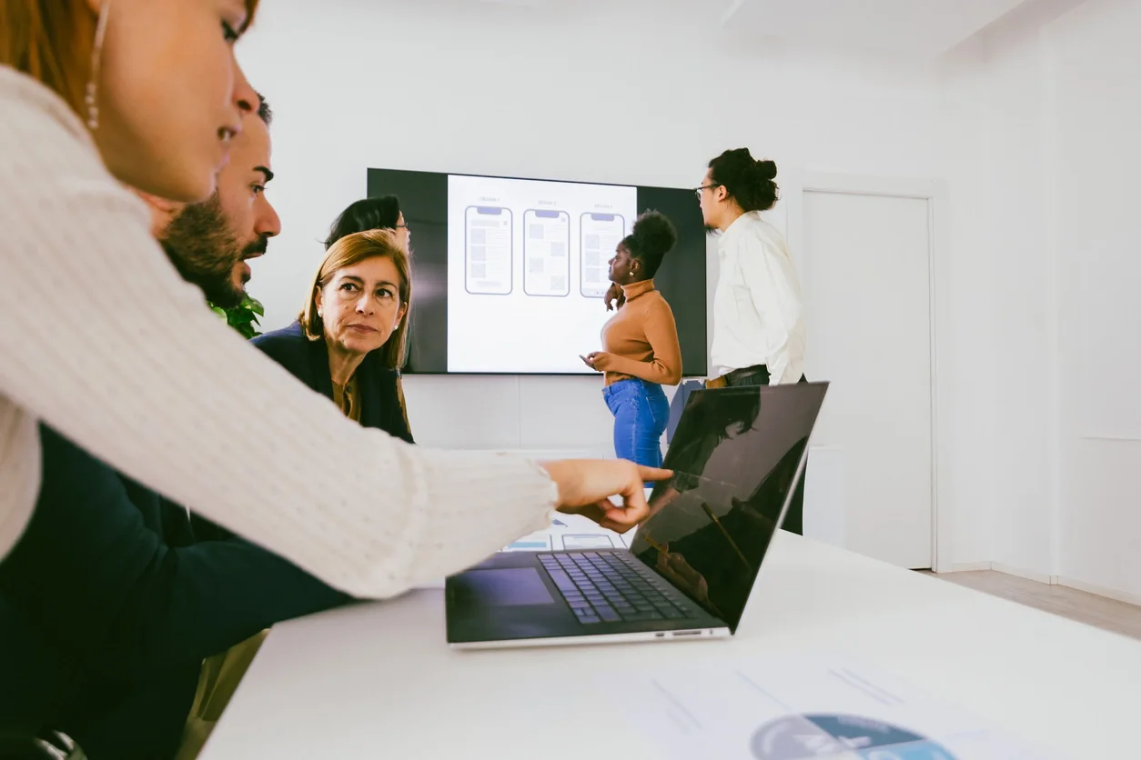 Conference venue with multiple breakout rooms using matching presentation screens, laptops, and AV support across sessions