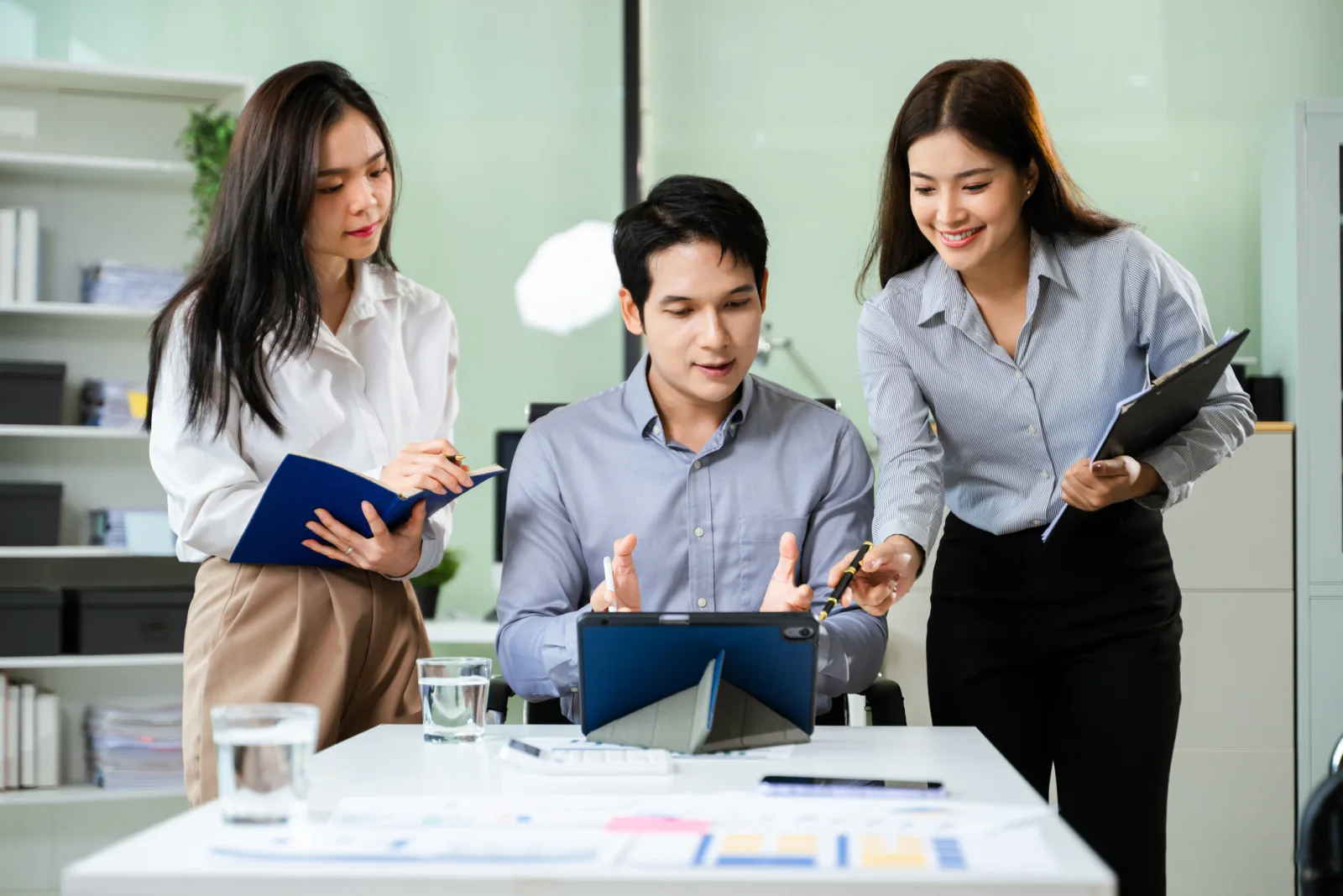 Logistics planning team coordinating multi-location technology shipments, delivery schedules, and receiving requirements