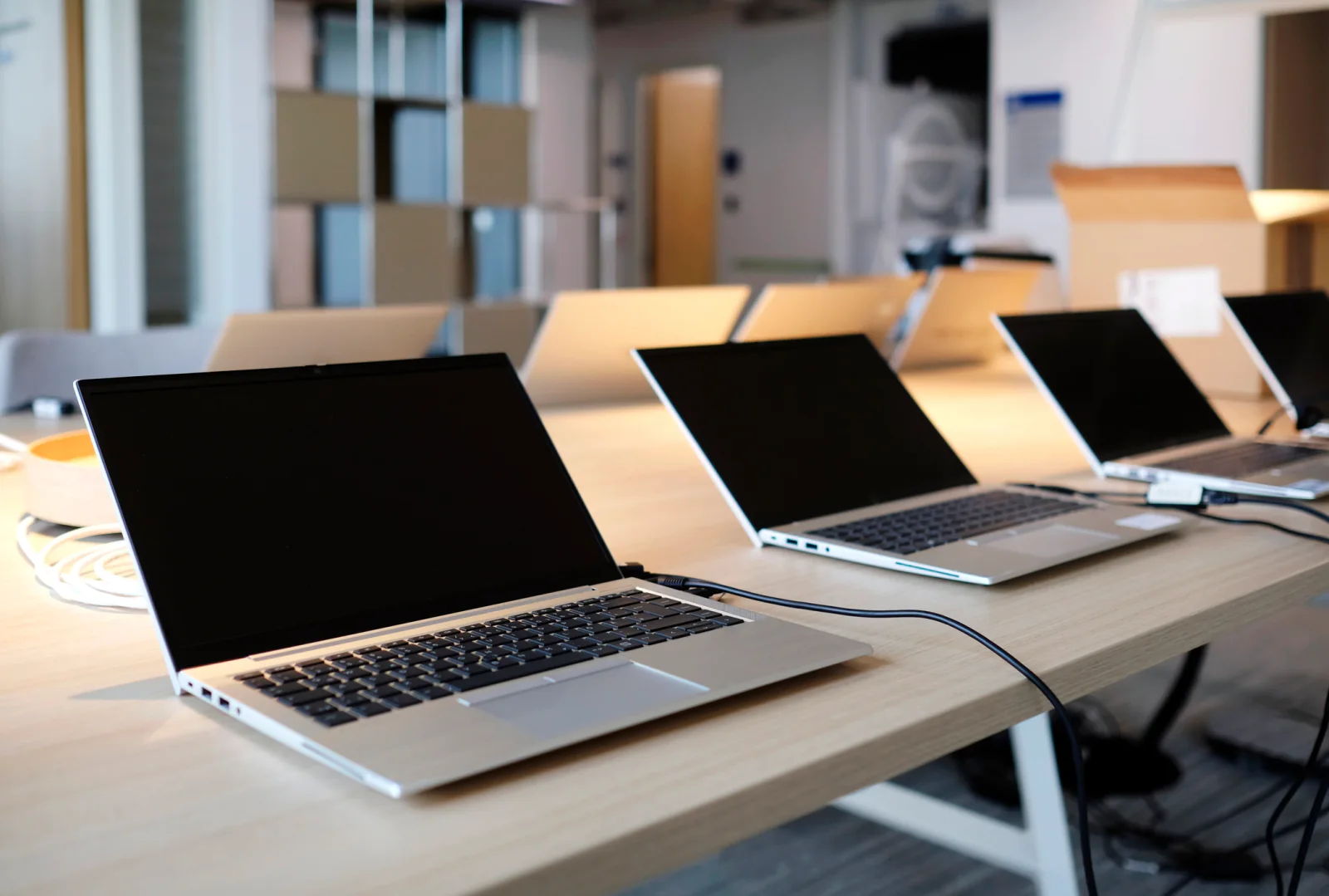 Bulk laptop deployment prepared for distribution to multiple offices, cities, and event locations