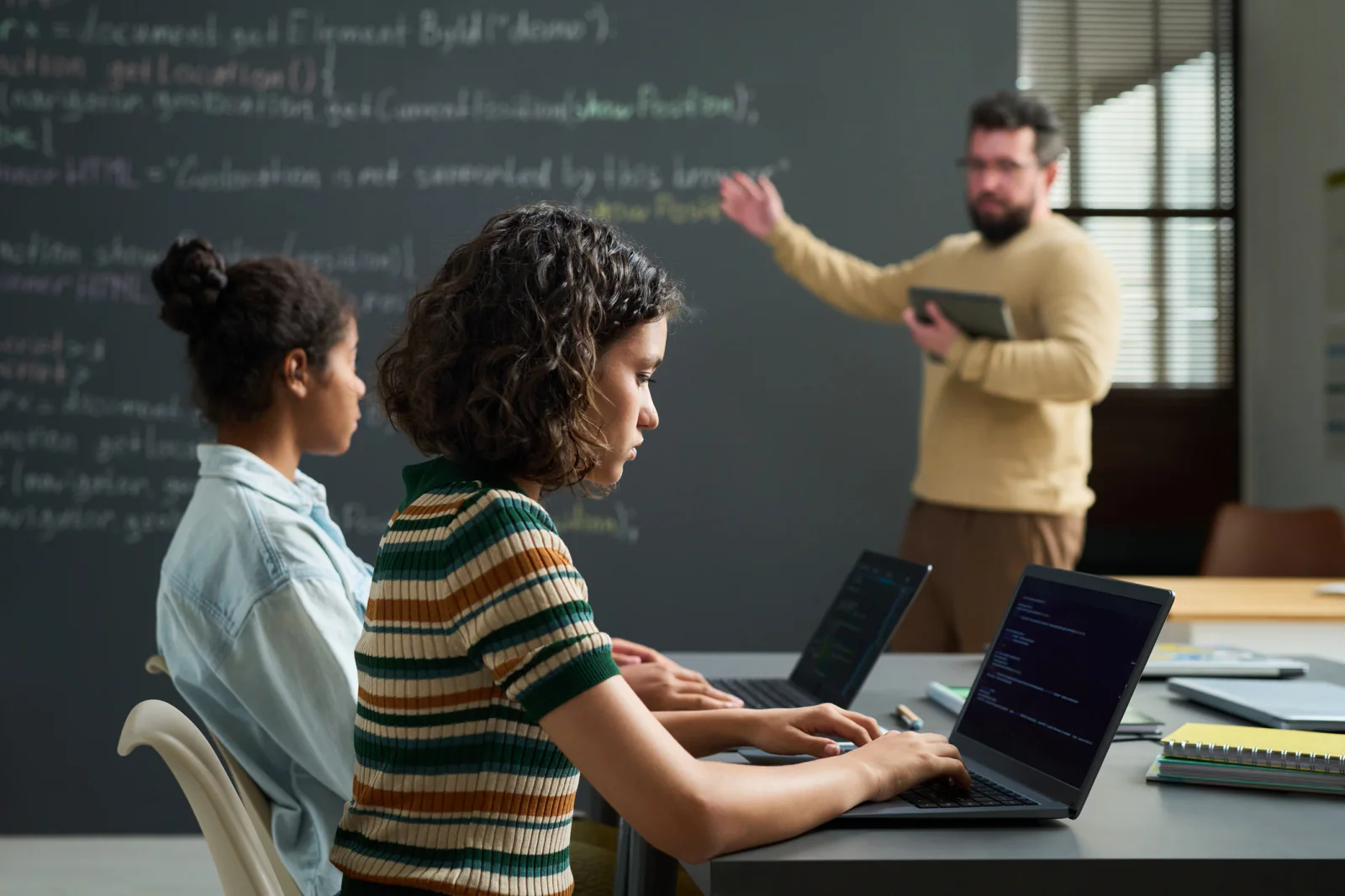 Classroom or onboarding program with standardized rental laptops configured with matching software and settings for every participant