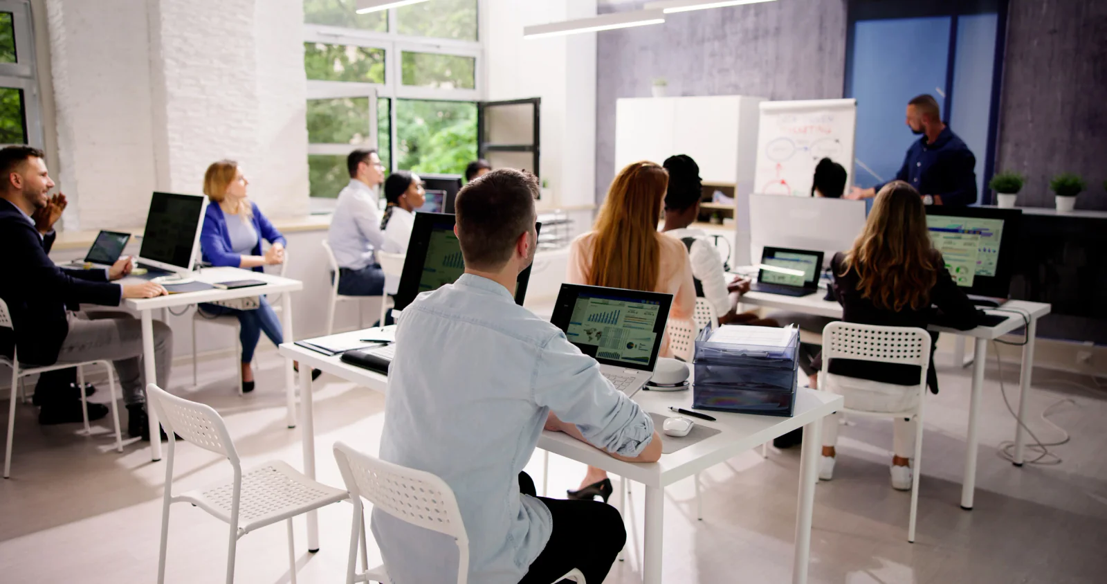 Temporary law firm office with desks, monitors, and laptop workstations