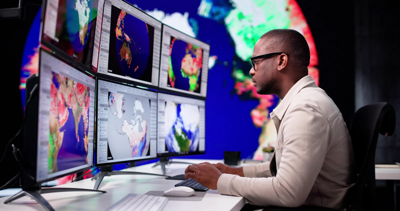 Video recording setup with production workstation, camera support equipment, monitors, and session capture workflow in a meeting venue